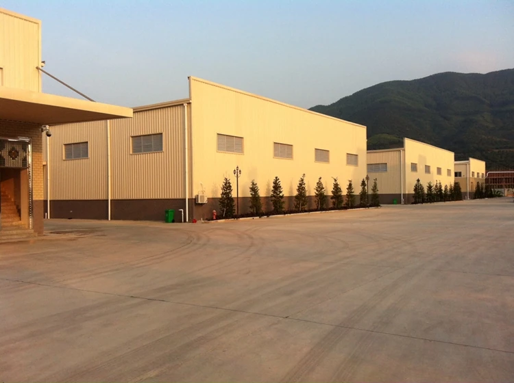 Exterior view of furniture factory buildings and the paved access area