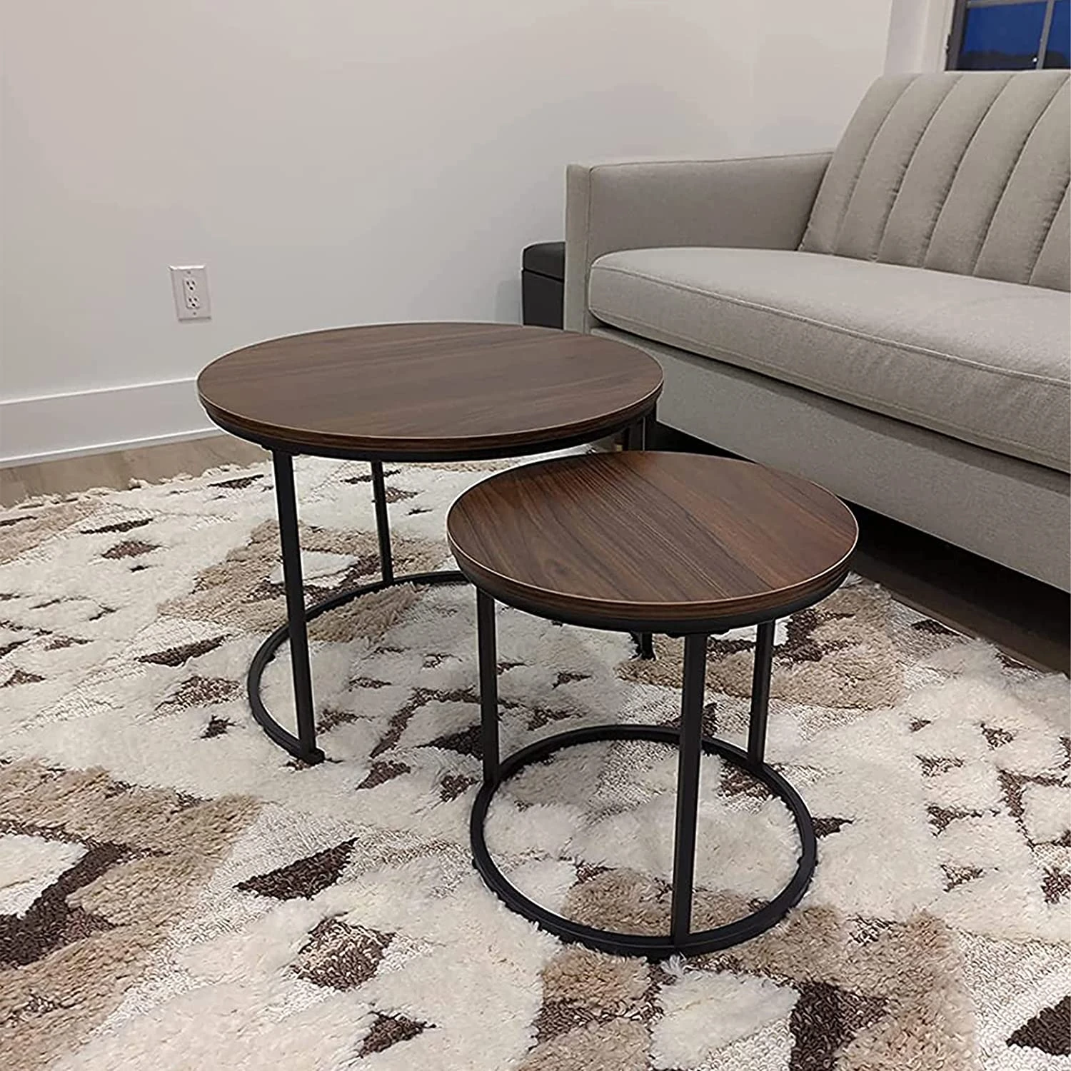 Round Nesting Coffee Table Set — nesting pair shown in a living room